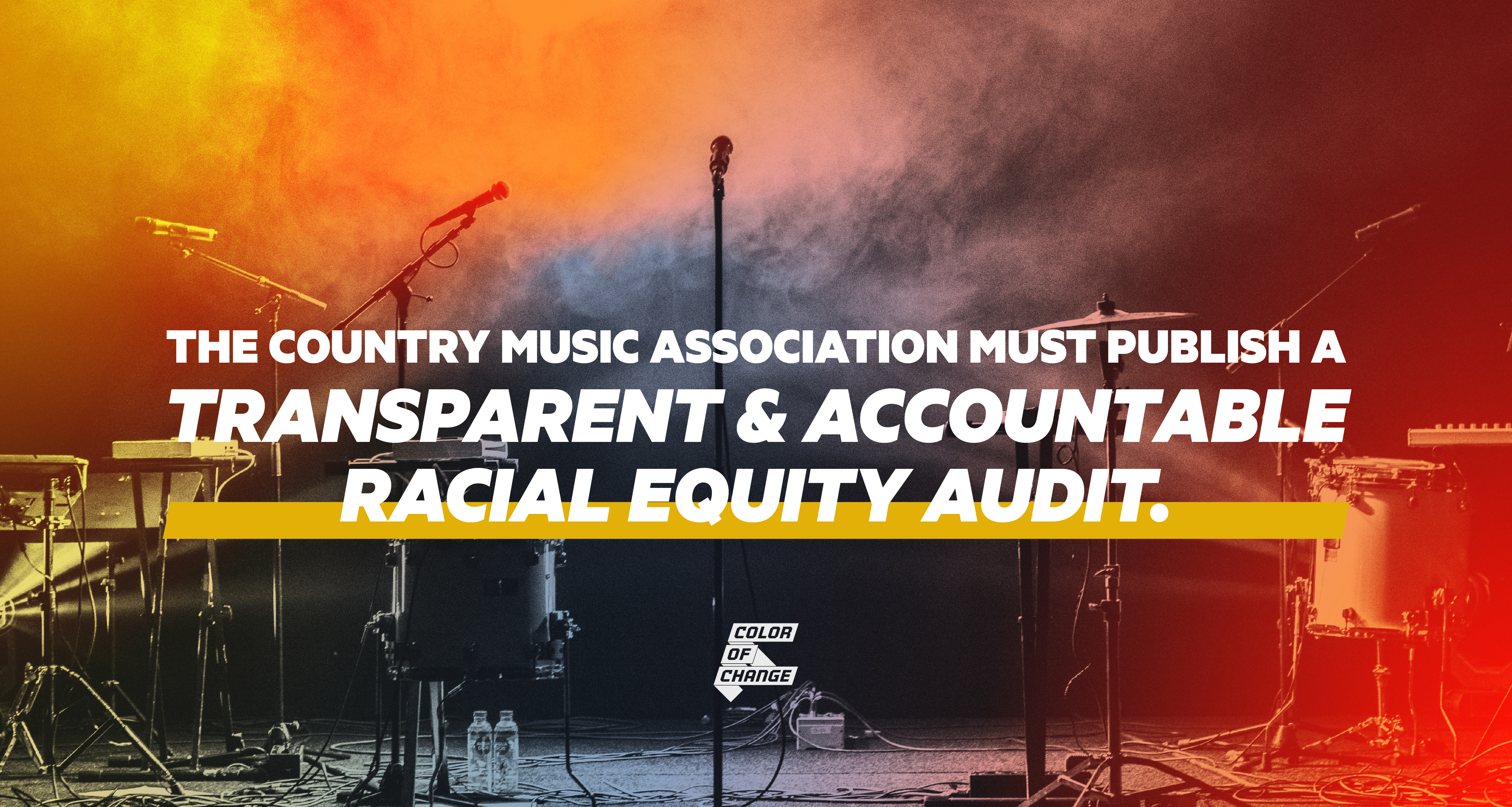 In the background is a black-and-white photo of a stage filled with country music instruments. It is layered with colors and smoke--yellows, oranges, and reds. Over top reads the campaign's call-to-action: 
